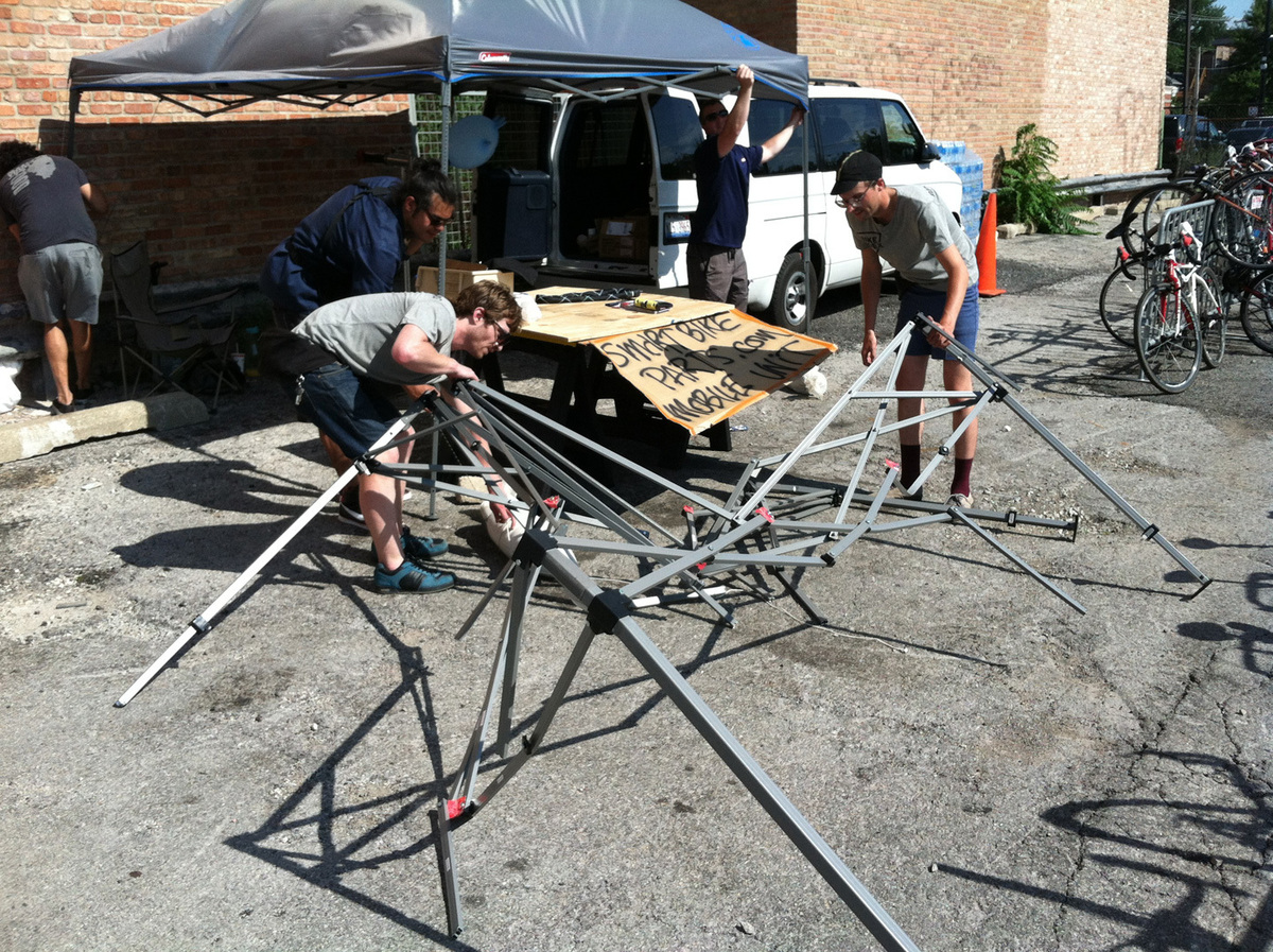 Bike Index breaking down the tent at Pitchfork Festival, 2013