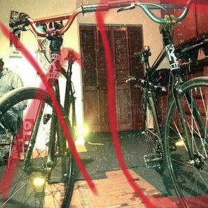 From Bikes Direct Black frame, many small white paint spots, Flip Flop with Blue/Green Handlebars now without front Wheel.  Black