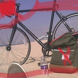 From Bikes Direct Black frame, many small white paint spots, Flip Flop with Blue/Green Handlebars now without front Wheel.  Black