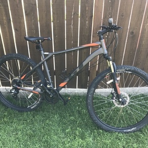 2018 GT Bicycles GT Aggressor Comp 27.5" Silver, gray or bare metal, Black, and Orange