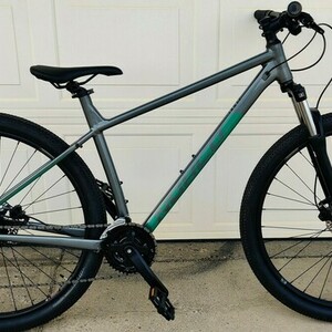 2023 Norco Bikes Storm 4 Silver, gray or bare metal and Green