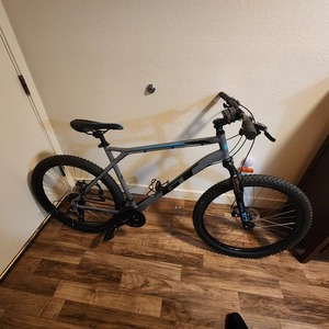 2023 GT Bicycles Aggressor Pro Silver, gray or bare metal, Teal, and Black