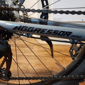 2023 GT Bicycles Aggressor Pro Silver, gray or bare metal, Teal, and Black