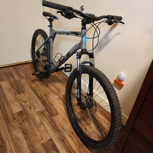2023 GT Bicycles Aggressor Pro Silver, gray or bare metal, Teal, and Black