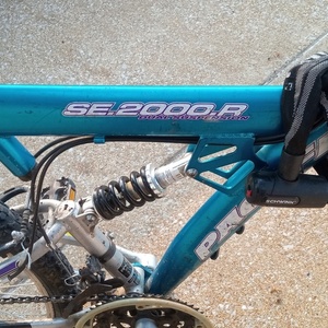 2003 Pacific Cycle XDS0702JC Teal and Silver, gray or bare metal