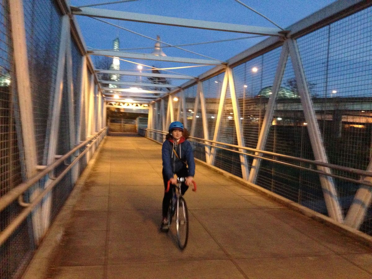 Erin bikes Portland bridge